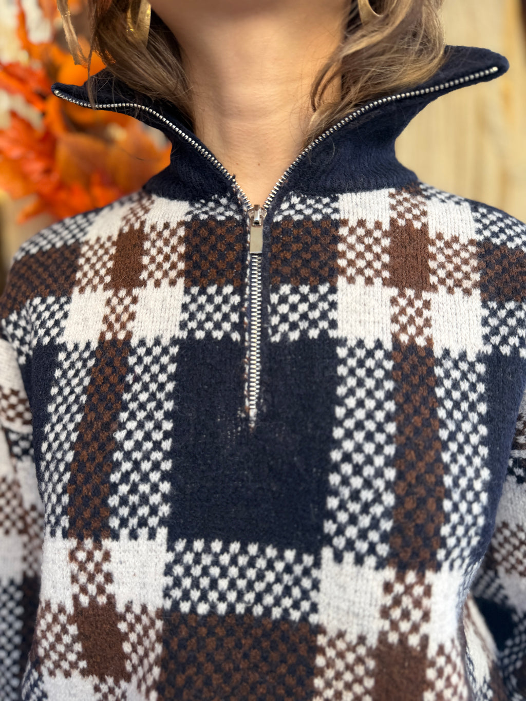 Pull en laine col montant zip à carreaux