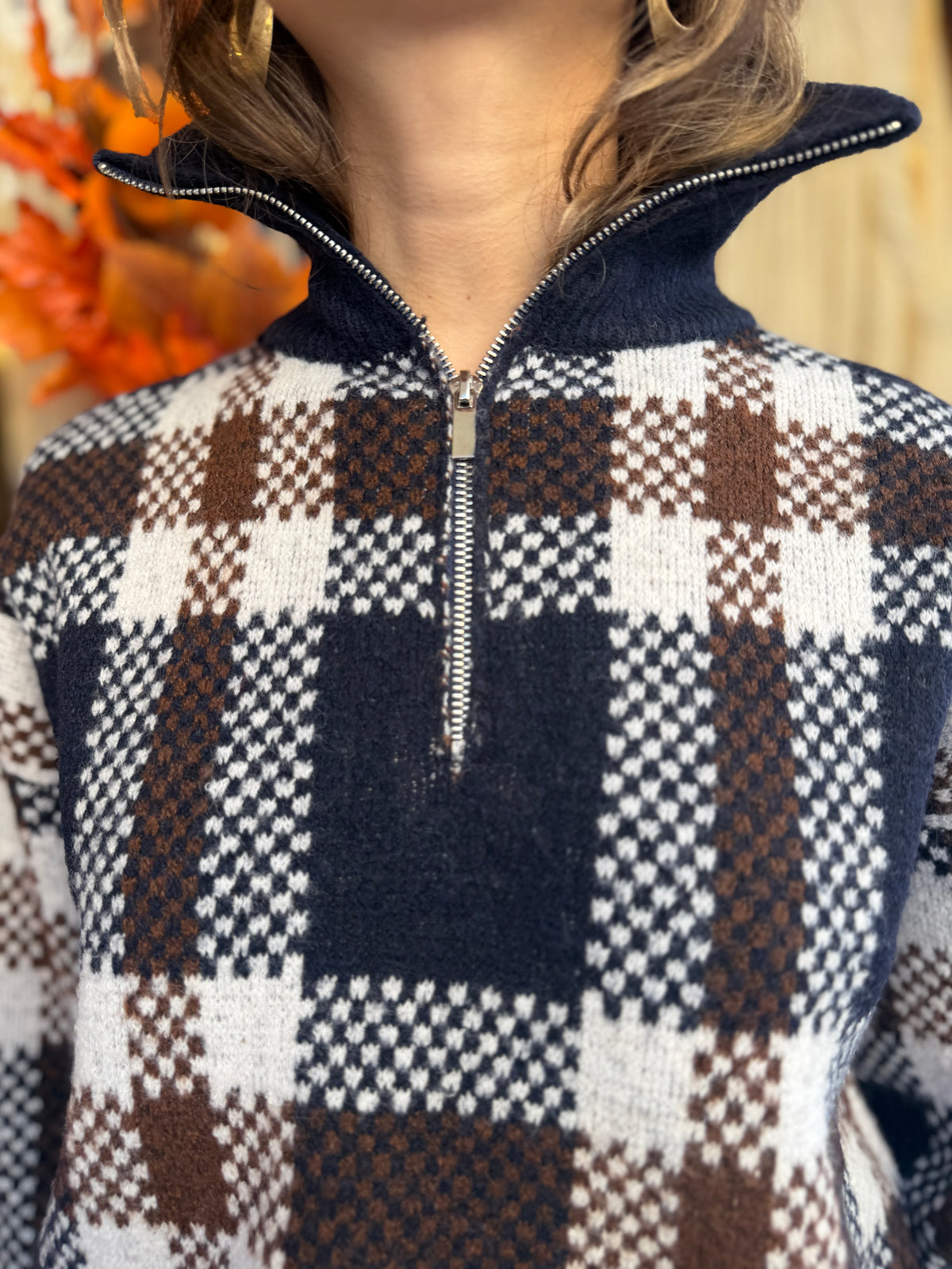 Pull en laine col montant zip à carreaux