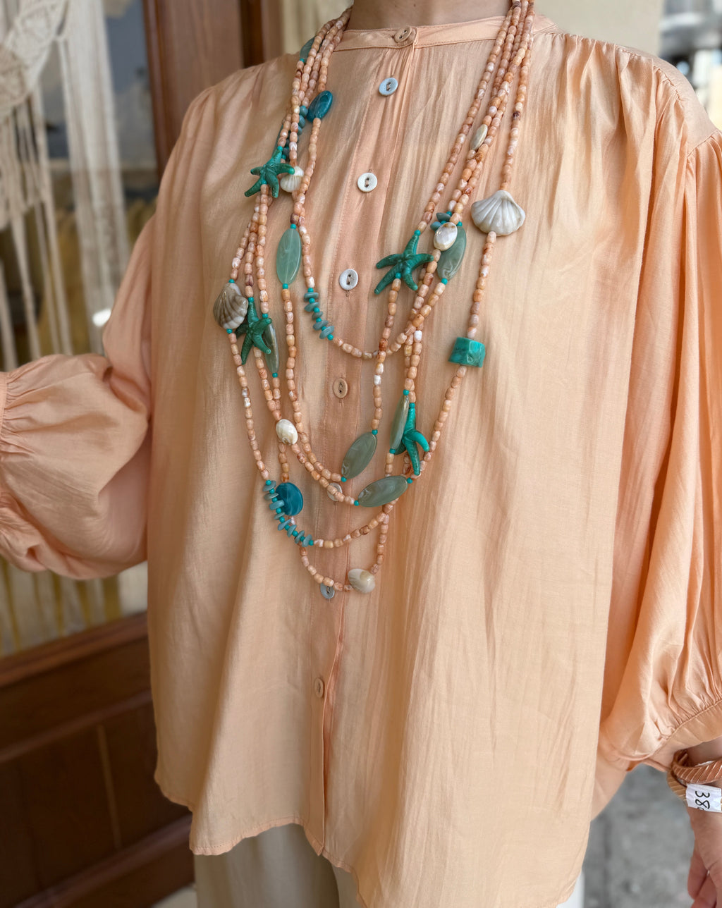 Collier multi-rangs en perles coquillages