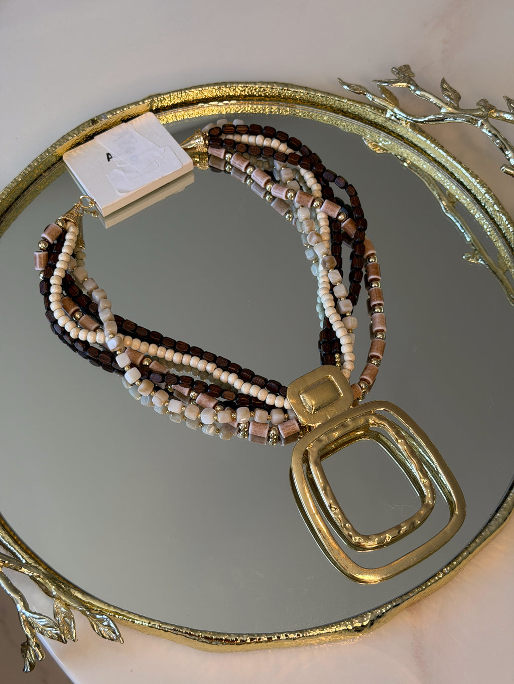 Collier Riviera multi chaînes pendentif doré