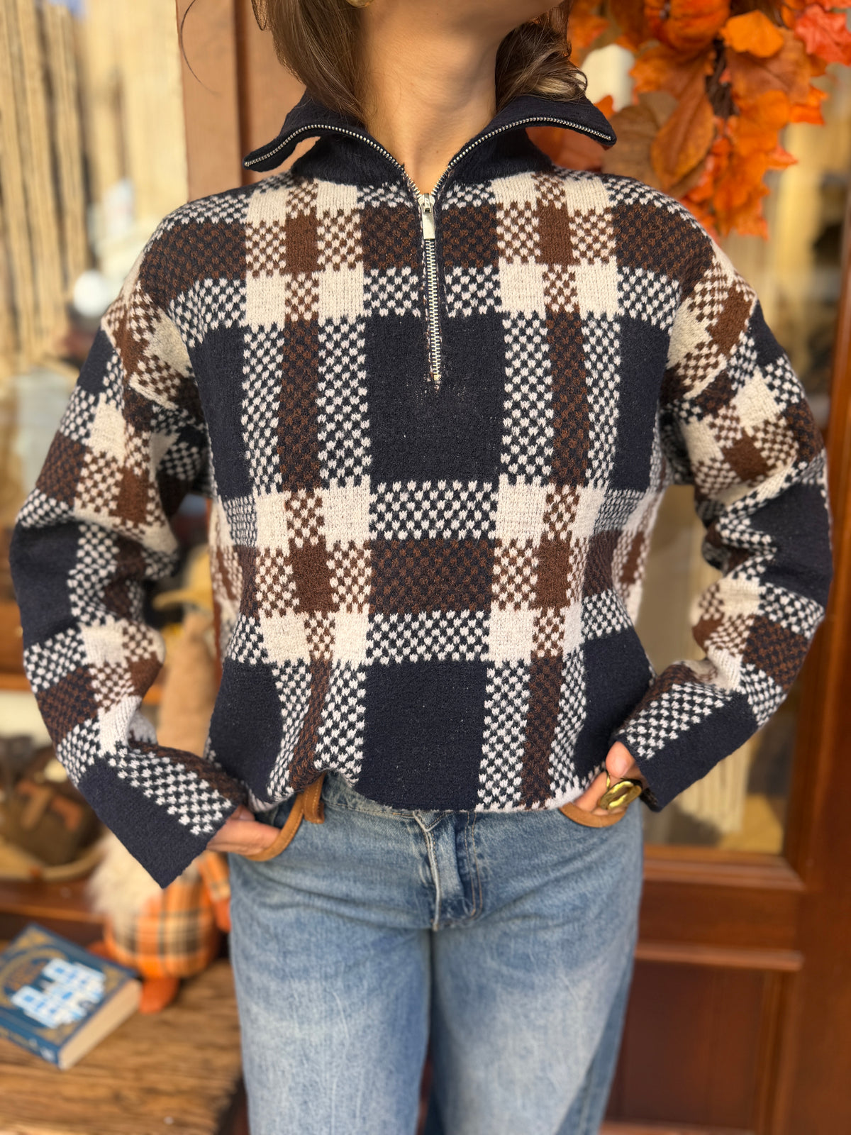 Pull en laine col montant zip à carreaux